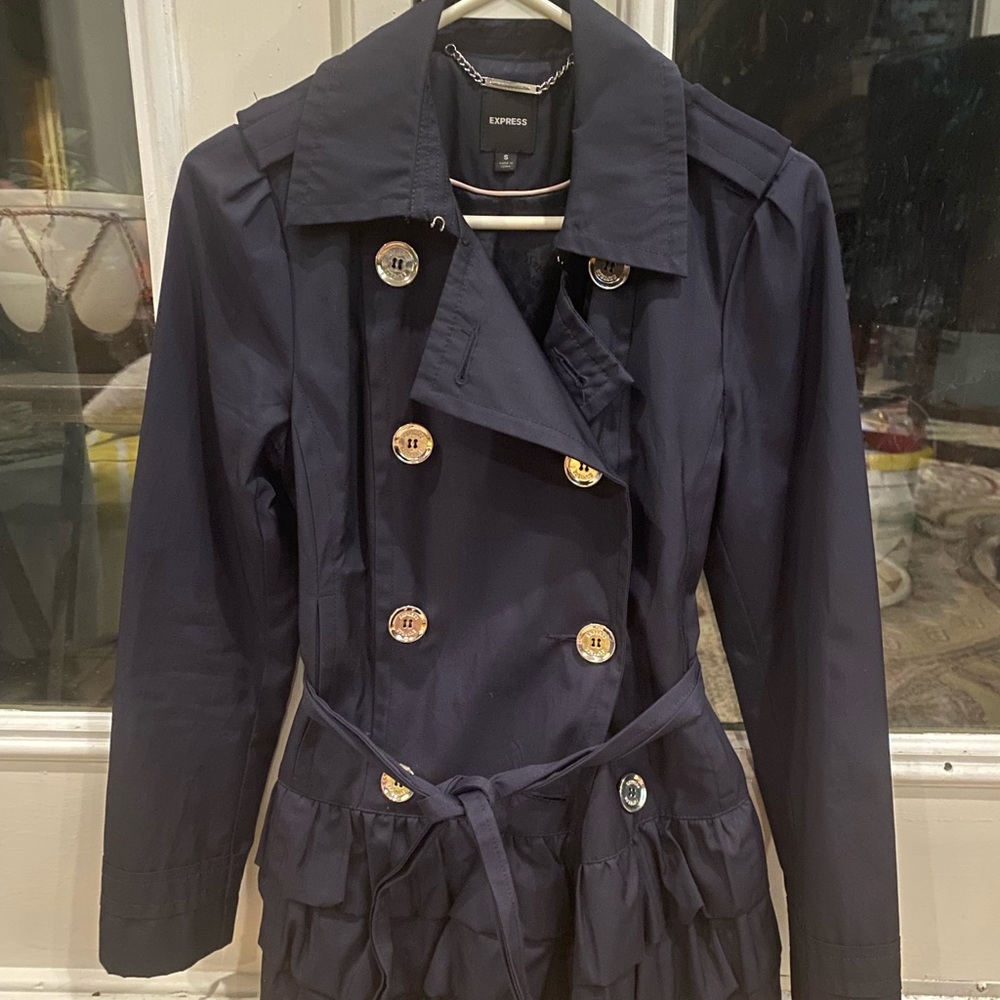 Navy blue pea coat with ruffle.